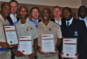 Back (from left): Mike Kidson (general manager ADT Johannesburg), Keith Alberts (ADT national operations director), Roy Rawlins (managing director ADT Central Region) and ADT Kusela area manager, Amos Nkosi. Front (from left): Award winners, ADT reaction officers Silas Ramadiba, Richard Zindela and William Themane with Bafana Zimu, ADT Kusela site supervisor